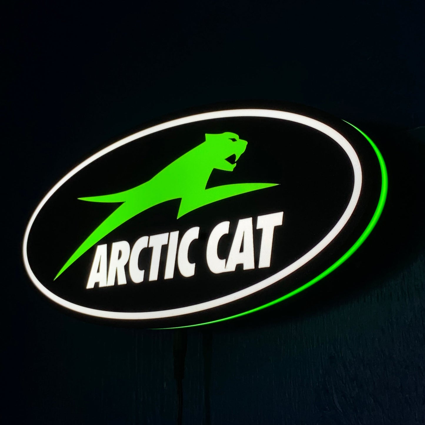 Arctic Cat led sign with green panther on a black background