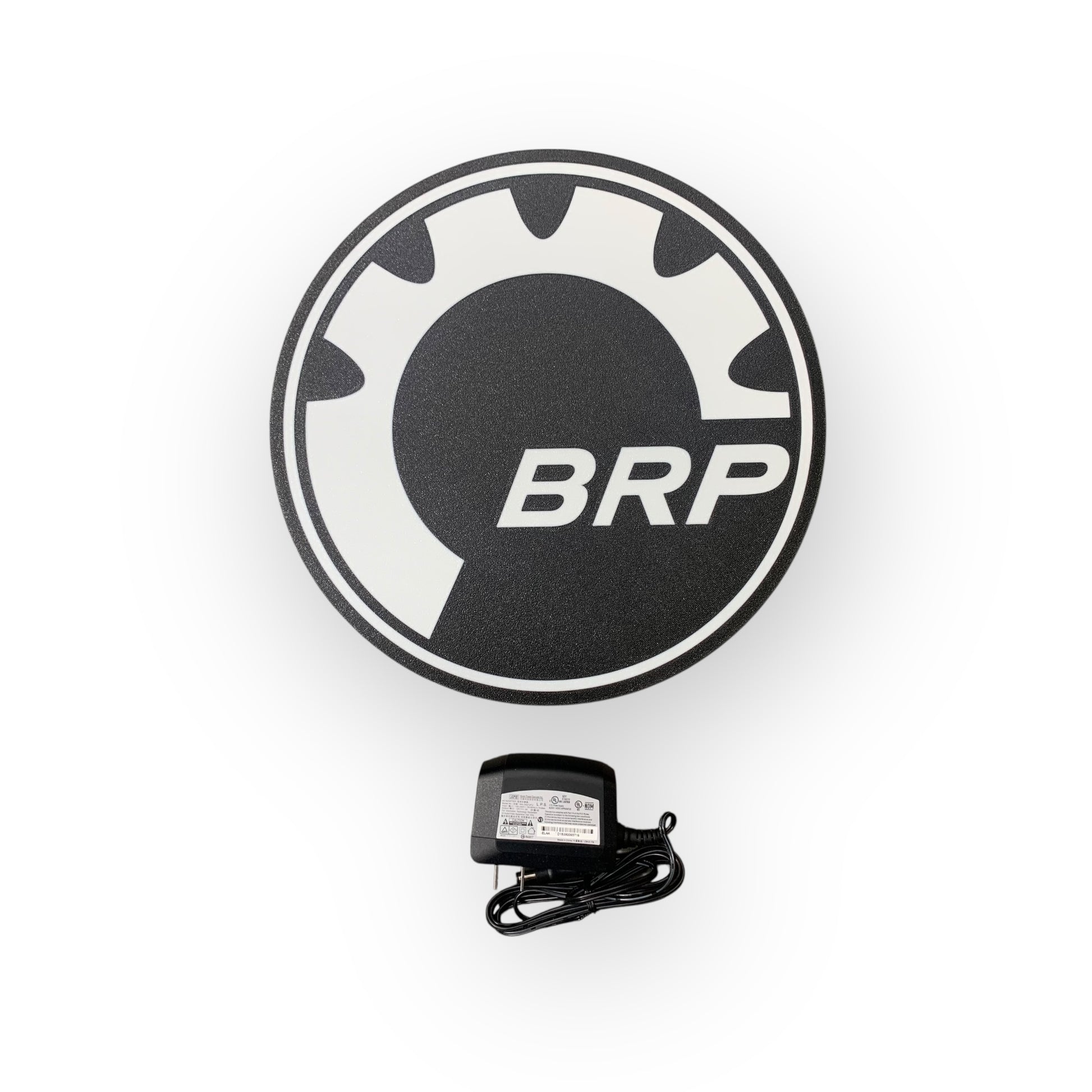 Round black and white logo with 'BRP' text on a white background on a led indoor sign