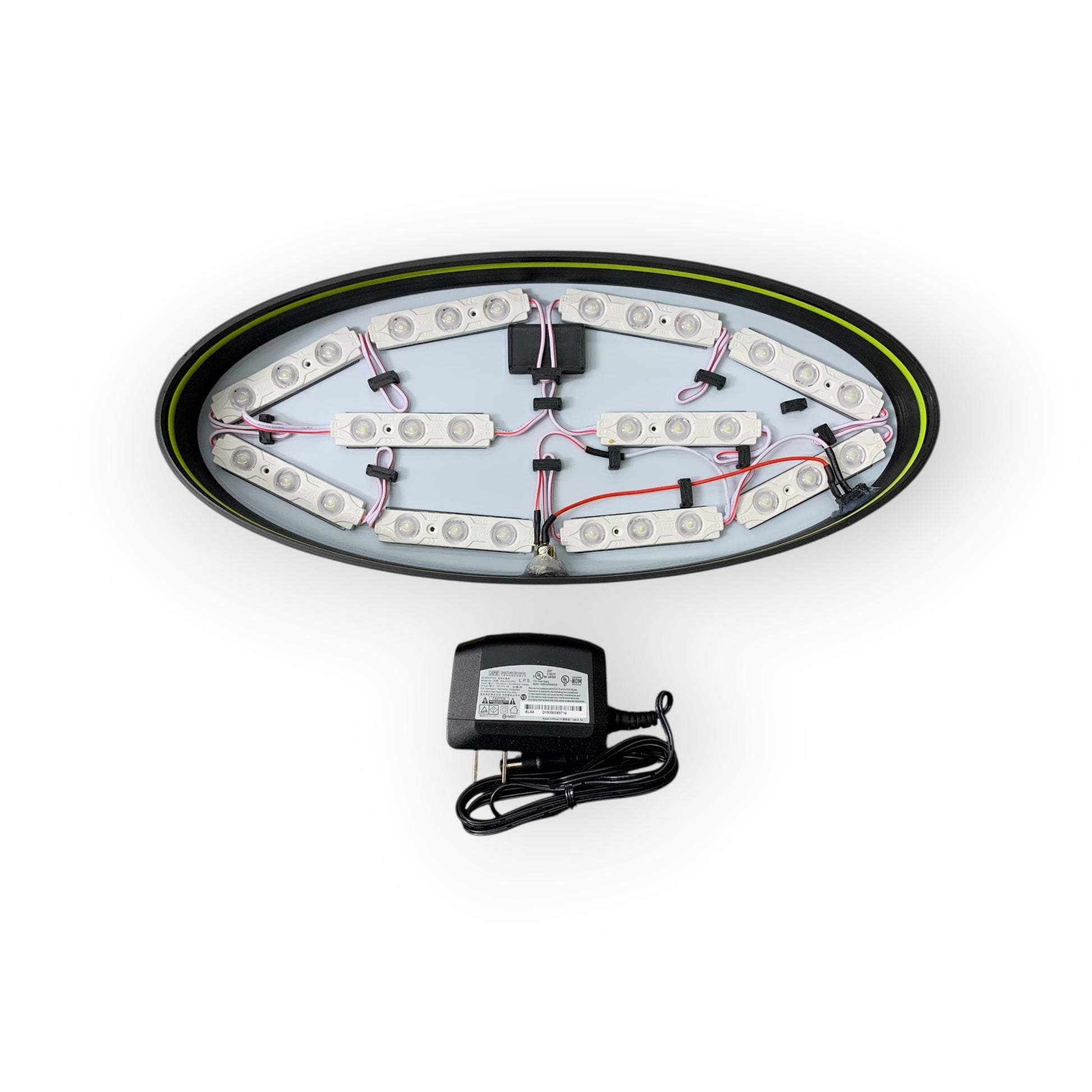 Inside of LED indoor sign showing 12V LED modules and a power adaptor