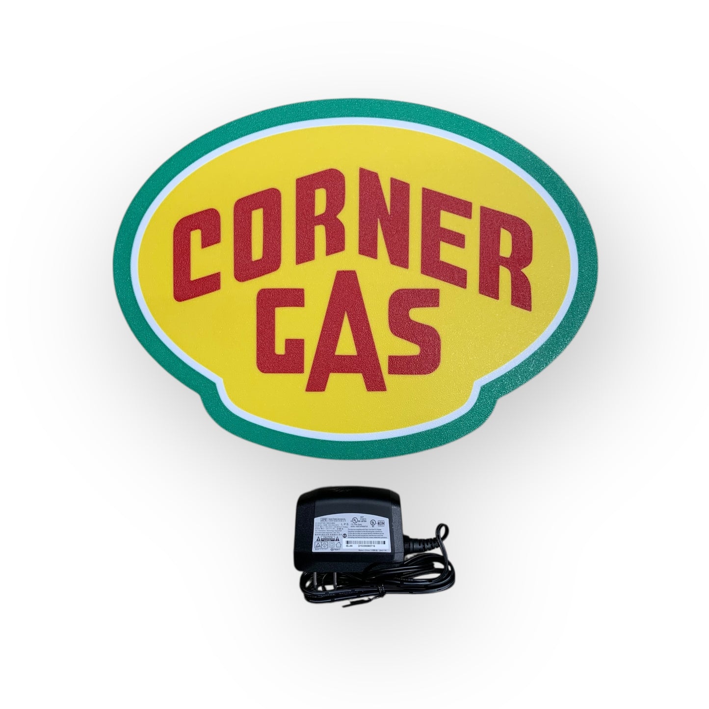 Corner Gas led indoor sign with a power adapter on a white background