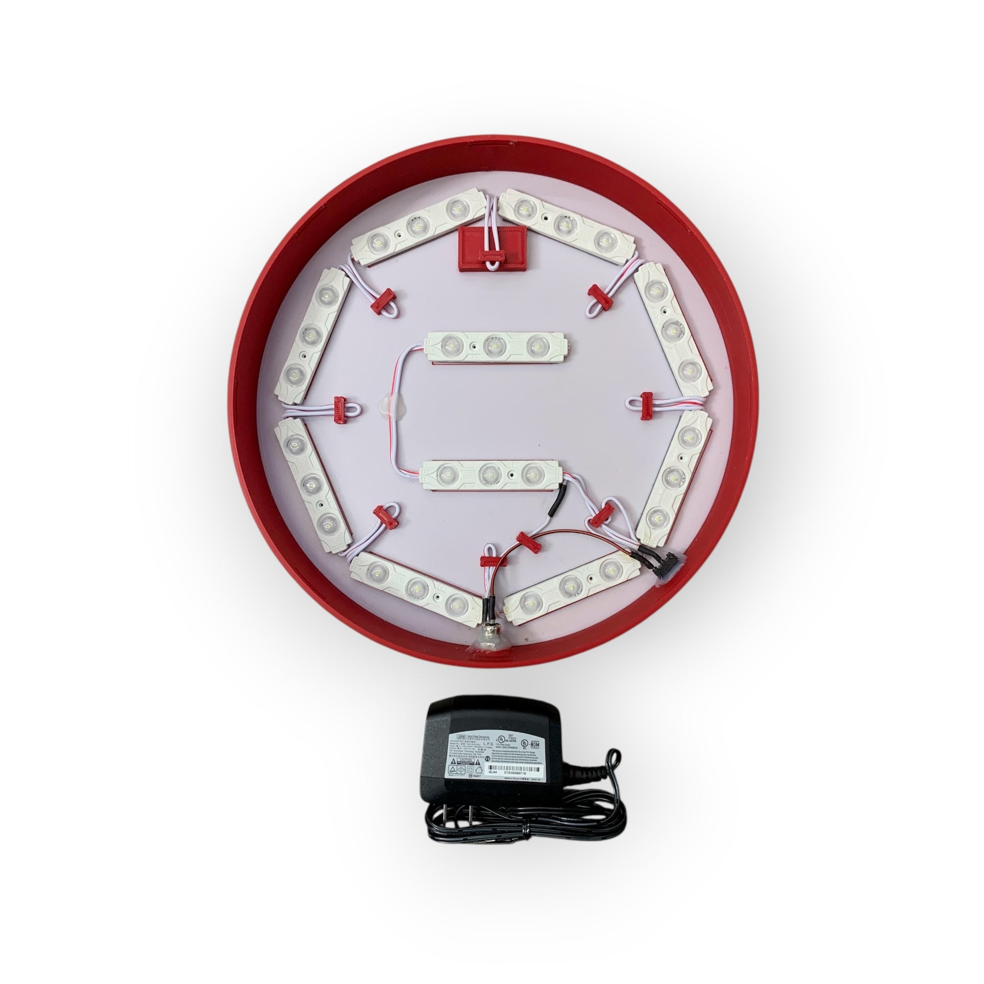 inside of LED sign with red frame and white face on a white background