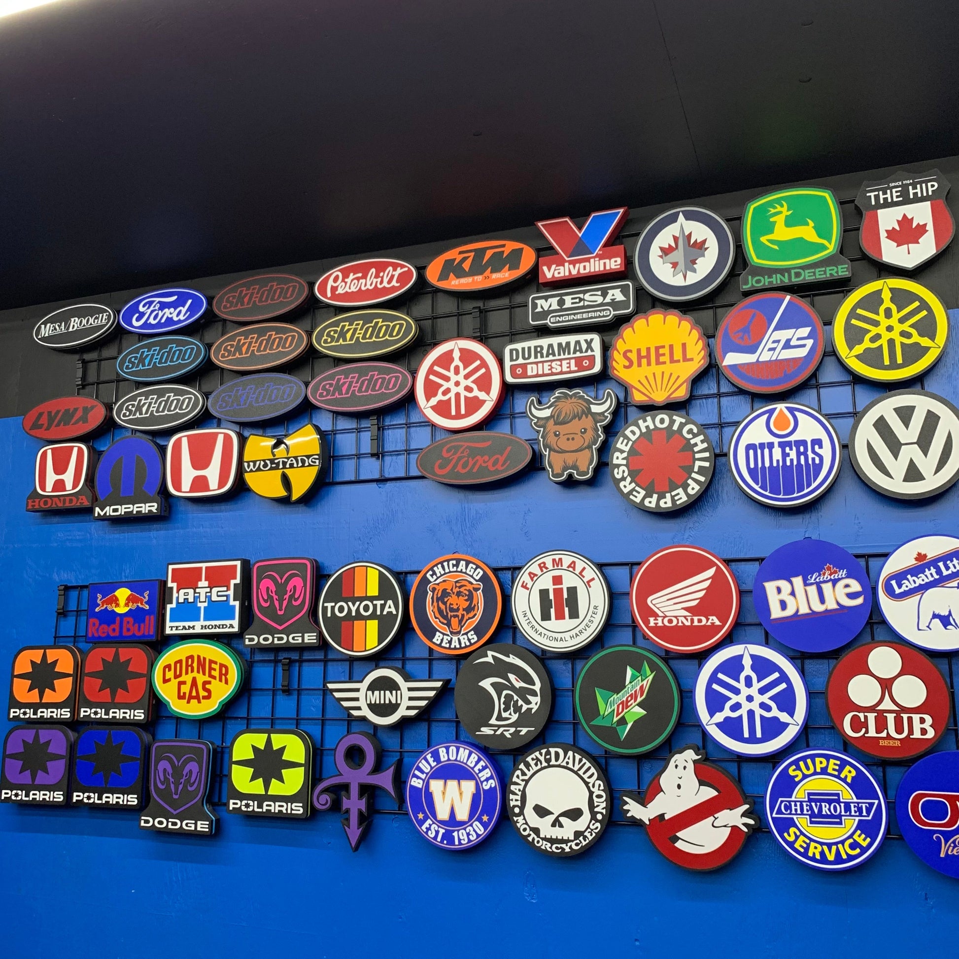 Collection of various brand logos of LED indoor signs on a blue background