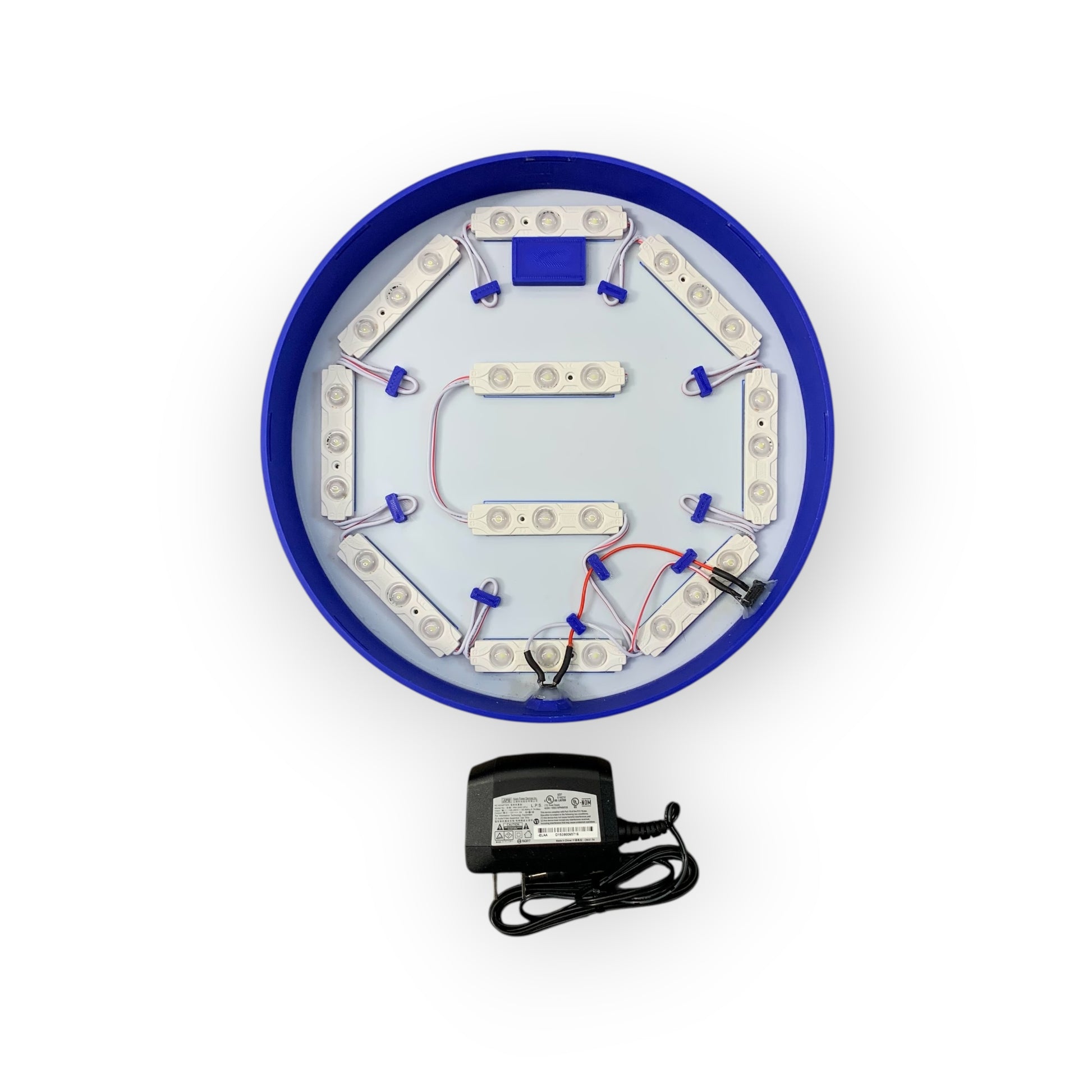 Circular electronic component with blue border and white interior on a white background