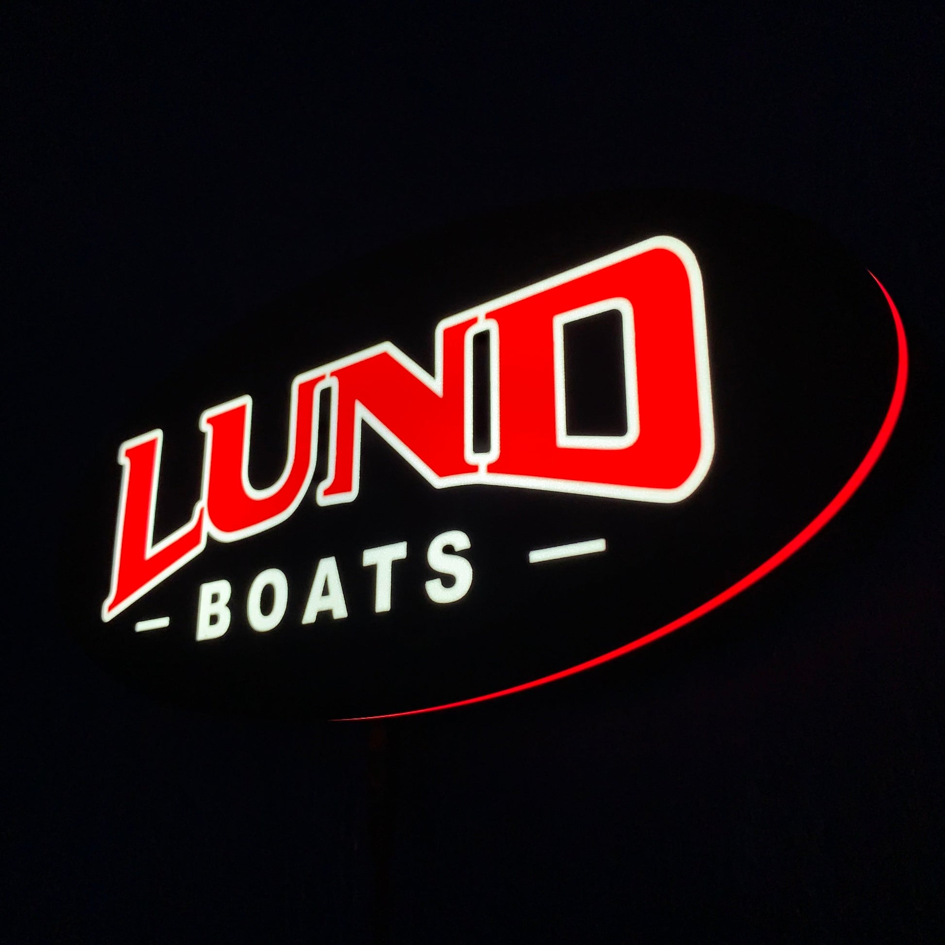 Lund Boats led indoor sign lit up on a black background