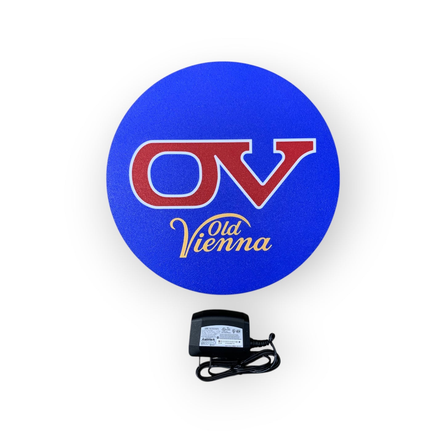 Blue circular led indoor sign with 'OV' and 'Old Vienna' text, accompanied by a power adapter on a white background.