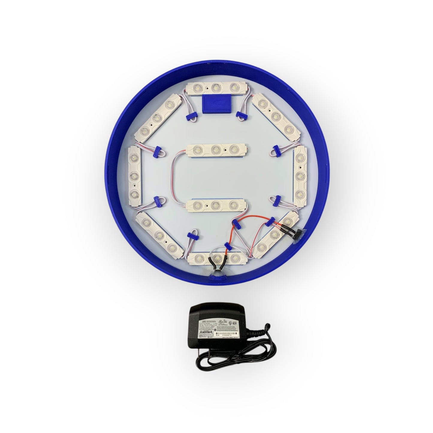 Circular electronic component with blue border and white interior on a white background