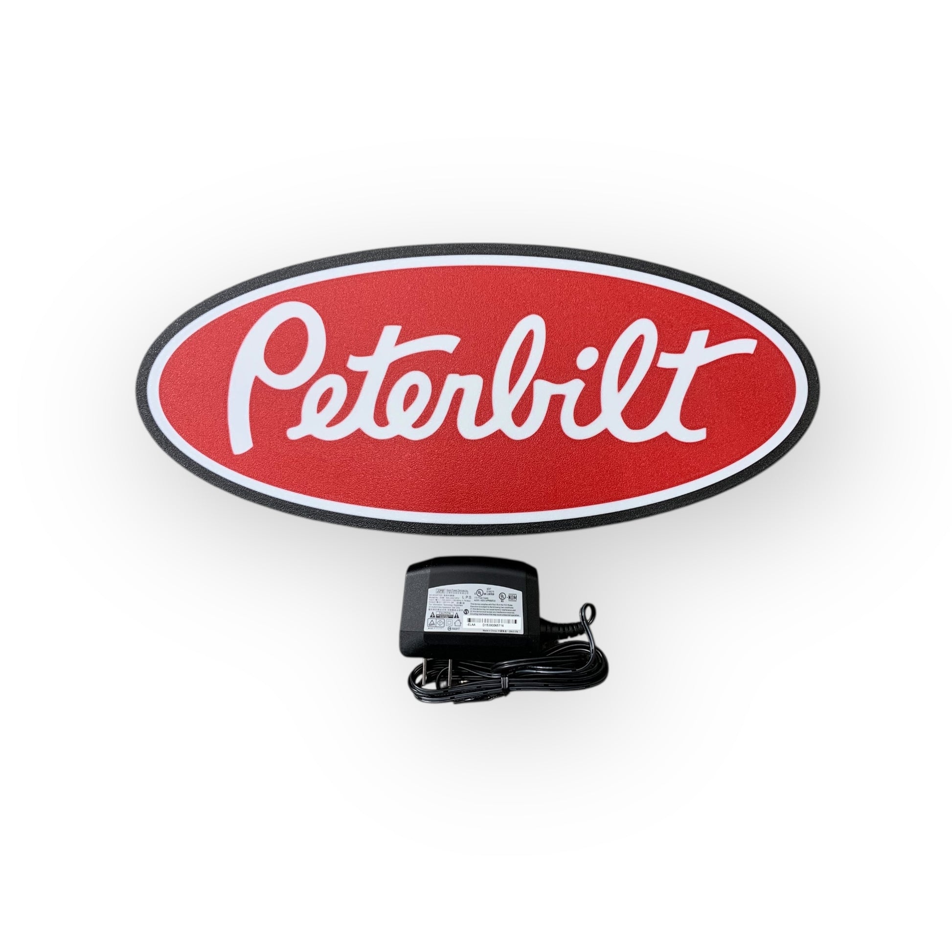 Peterbilt led indoor sign with a power adapter on a white background