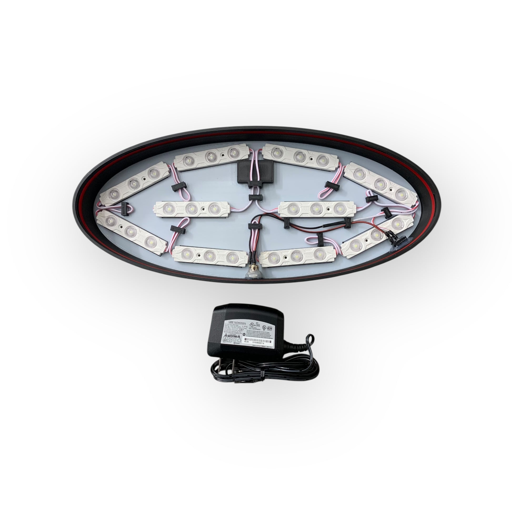 Inside of LED indoor sign showing 12V LED modules and a power adaptor