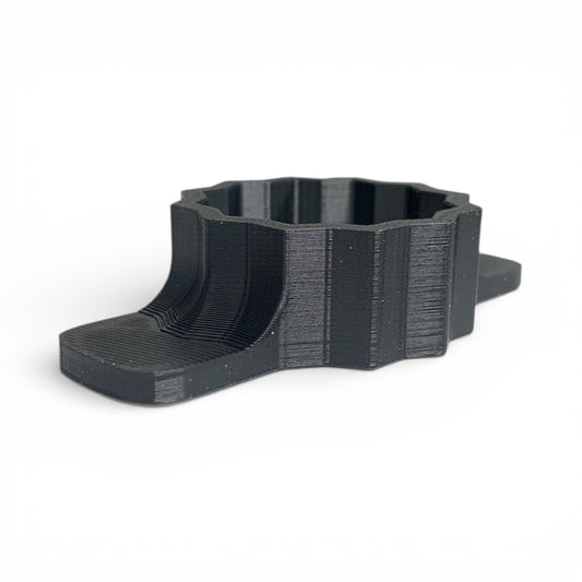 Black 3D-printed object on a white background