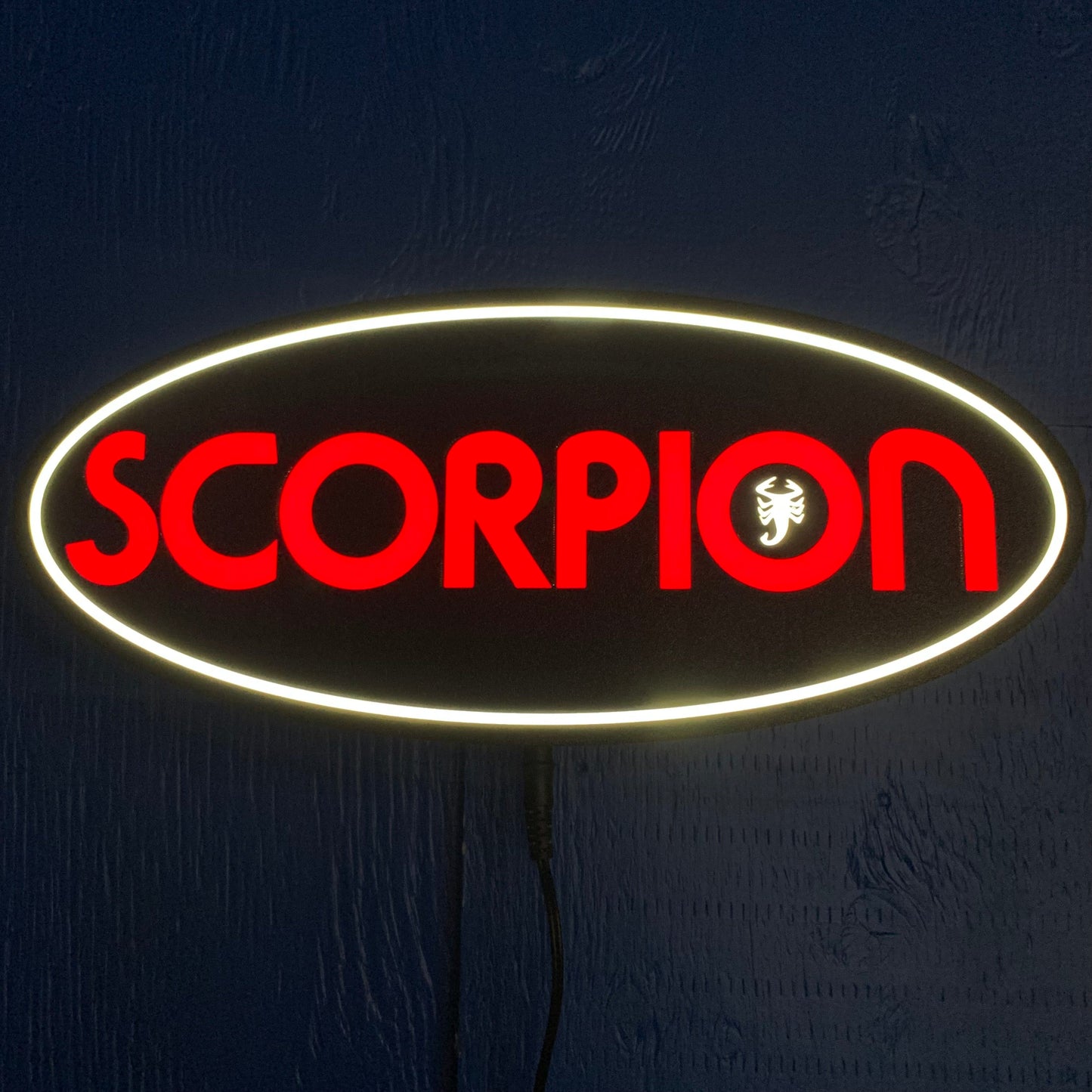 led  sign with 'SCORPION' logo on a dark background