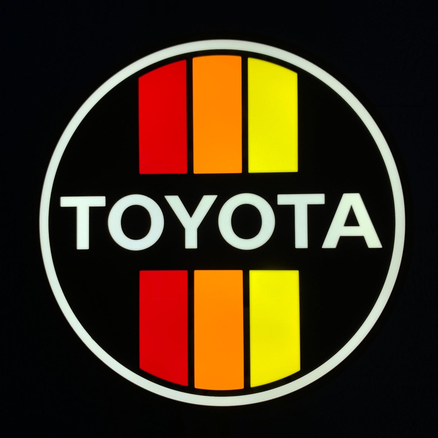 Toyota led indoor sign with red and yellow stripes on a black background